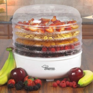 Food dehydrator with fruit in trays